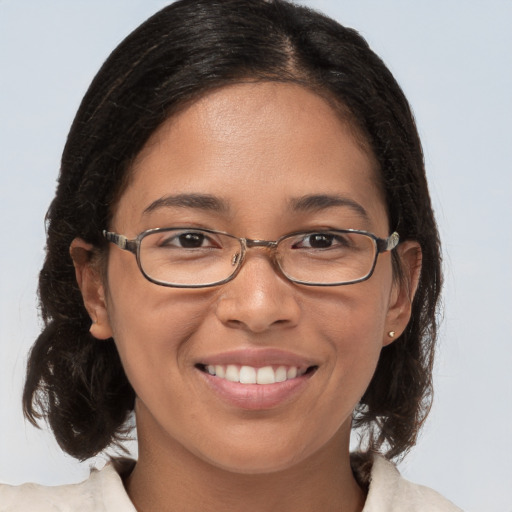 Joyful white adult female with medium  brown hair and brown eyes