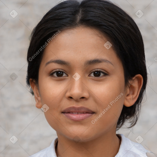 Joyful latino young-adult female with medium  brown hair and brown eyes