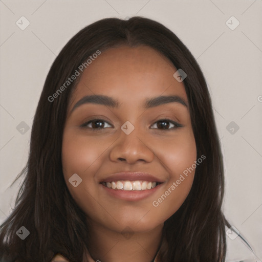 Joyful latino young-adult female with long  brown hair and brown eyes