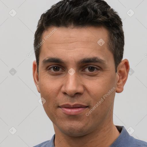 Joyful white adult male with short  brown hair and brown eyes