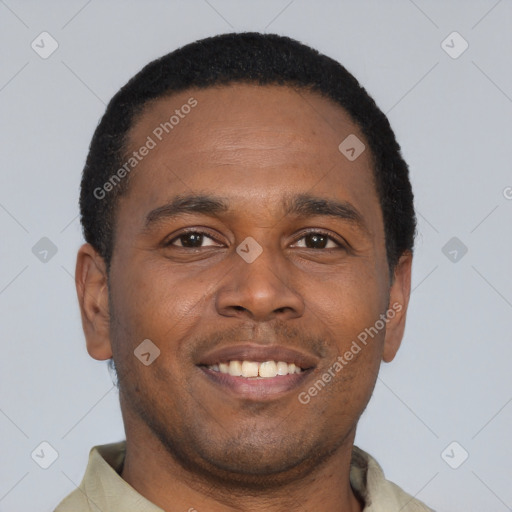Joyful latino young-adult male with short  brown hair and brown eyes
