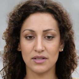 Joyful white adult female with long  brown hair and brown eyes