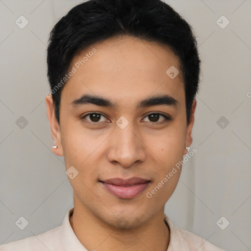 Joyful latino young-adult male with short  black hair and brown eyes