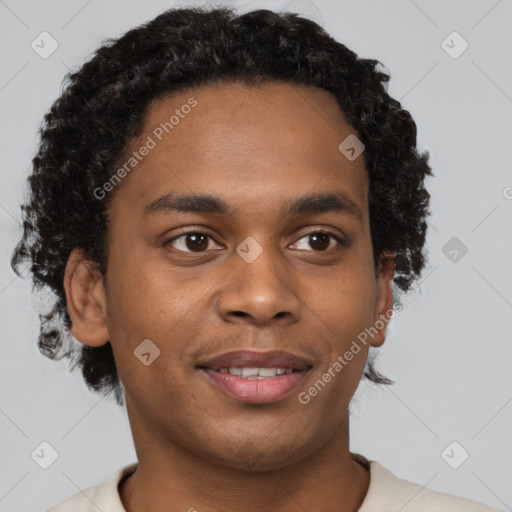 Joyful black young-adult male with short  brown hair and brown eyes