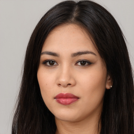 Neutral latino young-adult female with long  black hair and brown eyes