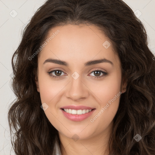 Joyful white young-adult female with long  brown hair and brown eyes