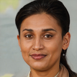 Joyful latino adult female with short  brown hair and brown eyes