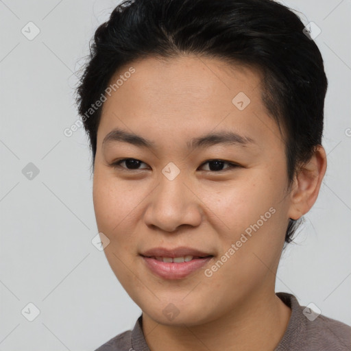 Joyful asian young-adult female with short  brown hair and brown eyes