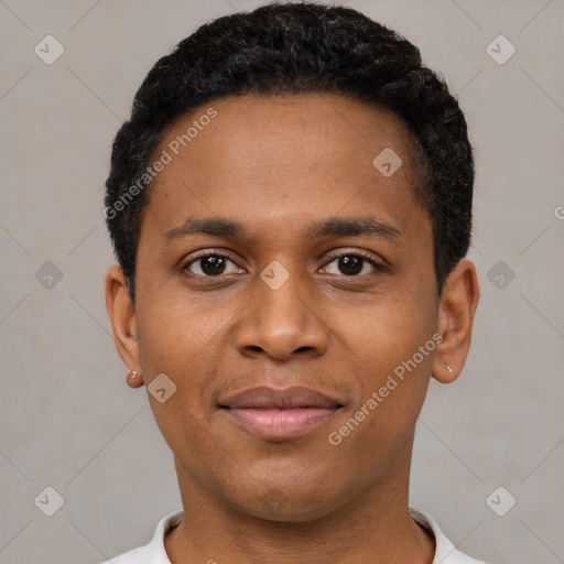 Joyful black young-adult male with short  black hair and brown eyes