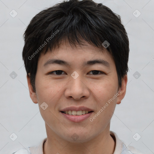 Joyful asian young-adult male with short  brown hair and brown eyes