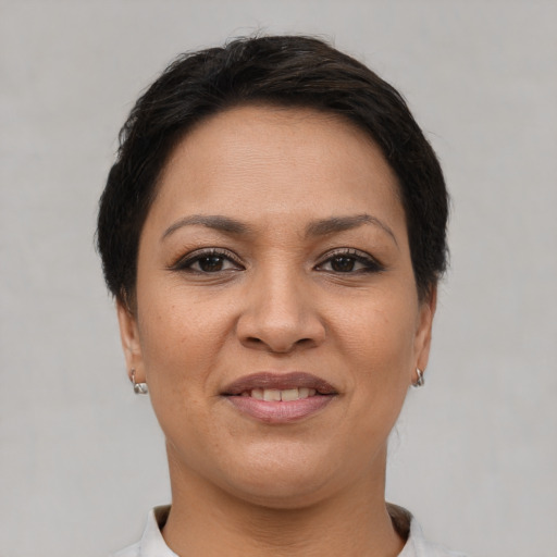 Joyful white young-adult female with short  brown hair and brown eyes