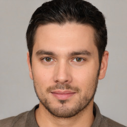 Joyful white young-adult male with short  brown hair and brown eyes