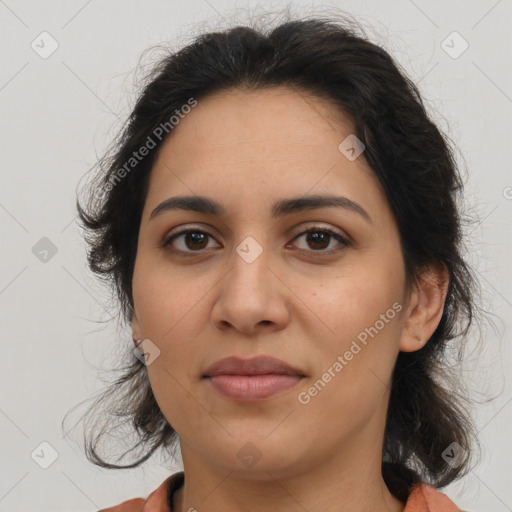 Joyful latino young-adult female with medium  brown hair and brown eyes