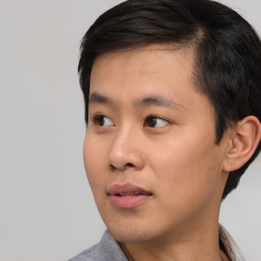 Neutral asian young-adult male with short  black hair and brown eyes