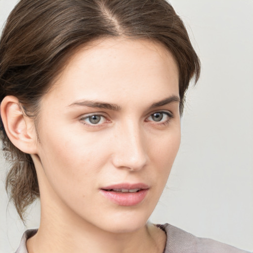 Neutral white young-adult female with medium  brown hair and grey eyes