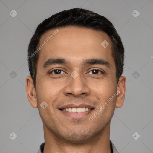 Joyful white young-adult male with short  black hair and brown eyes