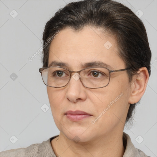 Joyful white adult female with short  brown hair and brown eyes