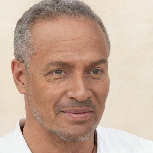 Joyful white middle-aged male with short  brown hair and brown eyes