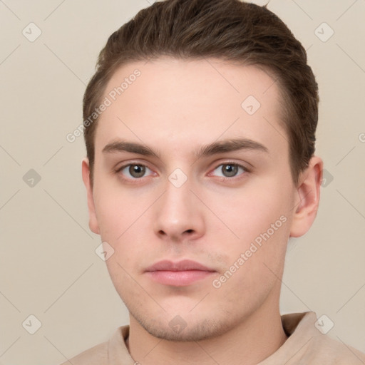 Neutral white young-adult male with short  brown hair and grey eyes