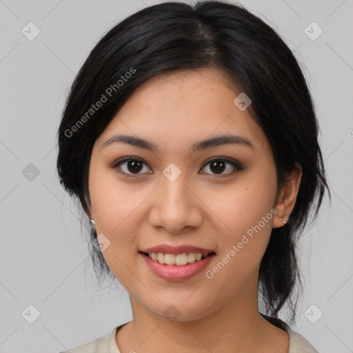 Joyful asian young-adult female with medium  black hair and brown eyes