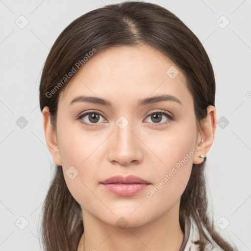 Neutral white young-adult female with long  brown hair and brown eyes