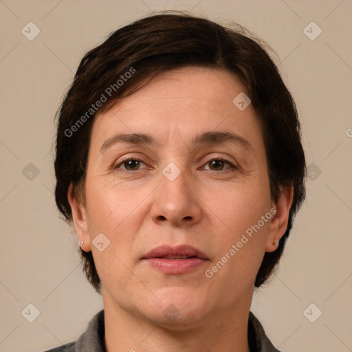 Joyful white adult female with short  brown hair and brown eyes