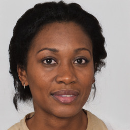 Joyful latino adult female with short  brown hair and brown eyes