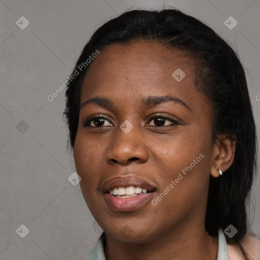 Joyful black young-adult female with long  black hair and brown eyes