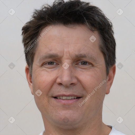 Joyful white adult male with short  brown hair and brown eyes