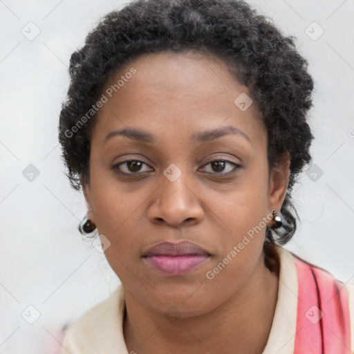 Joyful black young-adult female with long  brown hair and brown eyes