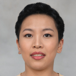 Joyful asian young-adult female with short  black hair and brown eyes