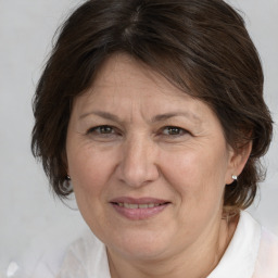 Joyful white middle-aged female with medium  brown hair and brown eyes