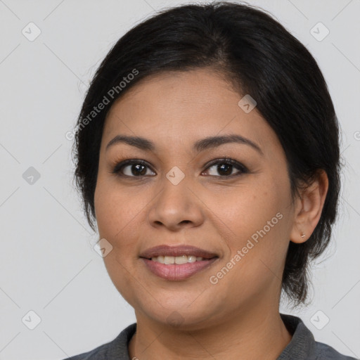 Joyful latino young-adult female with medium  brown hair and brown eyes