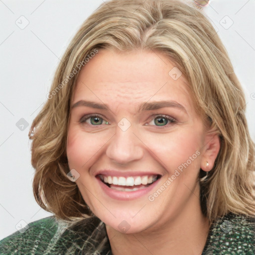 Joyful white young-adult female with medium  brown hair and green eyes