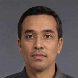 Neutral white adult male with short  black hair and brown eyes