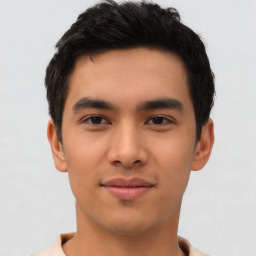 Joyful asian young-adult male with short  black hair and brown eyes