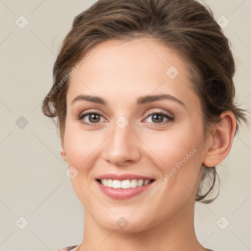 Joyful white young-adult female with medium  brown hair and green eyes