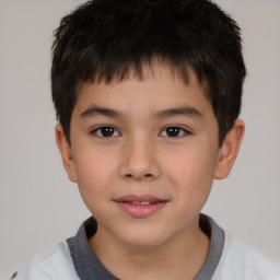 Joyful white child male with short  brown hair and brown eyes