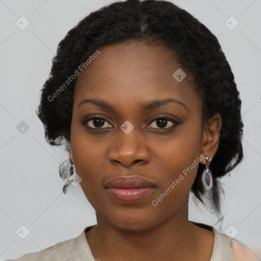 Joyful black young-adult female with medium  black hair and brown eyes