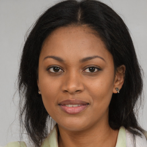 Joyful black young-adult female with medium  brown hair and brown eyes