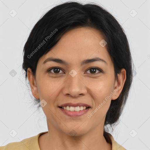 Joyful latino adult female with medium  brown hair and brown eyes