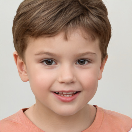 Joyful white child male with short  brown hair and brown eyes