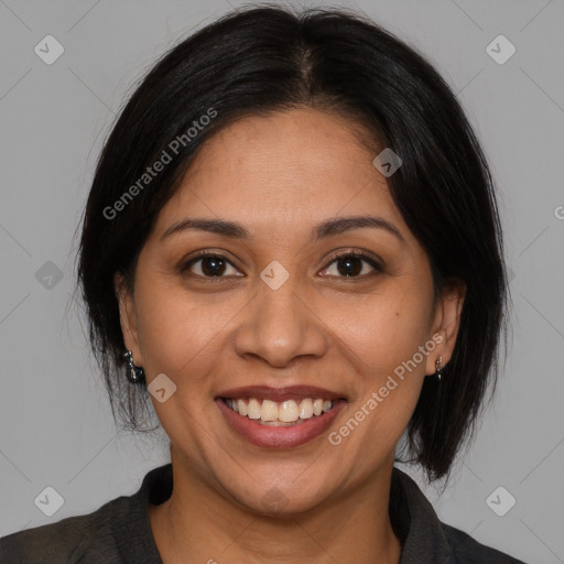 Joyful latino young-adult female with medium  brown hair and brown eyes