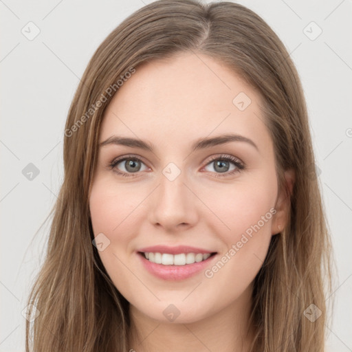 Joyful white young-adult female with long  brown hair and green eyes