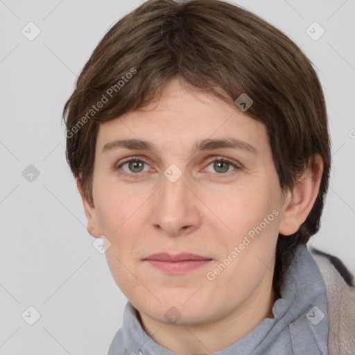 Joyful white adult female with short  brown hair and grey eyes