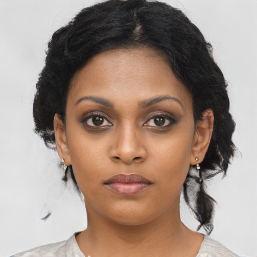 Neutral black young-adult female with medium  black hair and brown eyes