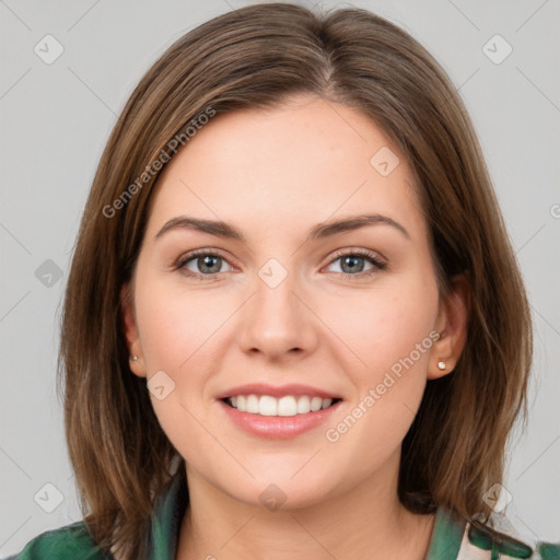 Joyful white young-adult female with medium  brown hair and green eyes