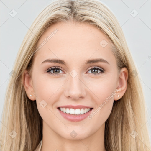 Joyful white young-adult female with long  brown hair and blue eyes