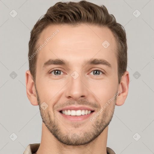 Joyful white young-adult male with short  brown hair and grey eyes