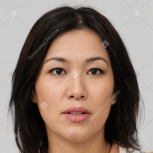 Joyful asian young-adult female with medium  brown hair and brown eyes